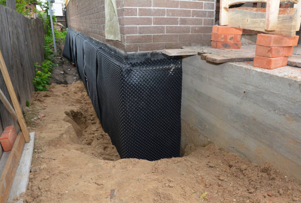 Happy homeowners after waterproofing job in Murray City